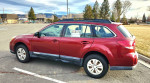 2012 Subaru Outback 2.5i AWD in great condition for sale, showcasing its side profile and spacious design.