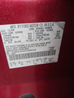 2000 Ford Excursion label showing specifications and manufacturing details, located in a towing yard.