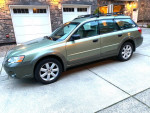 2006 Subaru Forrester 2.5 X AWD parked in driveway, showcasing clean exterior and alloy wheels.