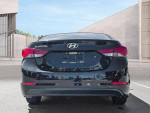 Rear view of a 2013 Hyundai Elantra in black, showcasing its sleek design and clean lines.