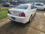 2008 Chevrolet Malibu hybrid parked in a driveway, showcasing its clean exterior and efficient design.
