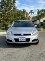 Front view of a 2013 Chevrolet Impala LTZ FWD with 132,000 miles, in excellent condition and silver color.