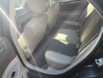 Interior view of a Chrysler 300 Touring Sedan with leather bucket seats and spacious rear seating.