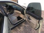 Interior view of a 2007 Subaru Outback with doors open, showcasing spacious seating and modern features.