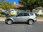 2007 BMW X3 3.0si AWD in silver color, parked outside, showcasing its well-maintained exterior and compact SUV design.