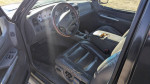 Interior of a 2001 Ford Explorer with black leather seats and steering wheel.