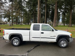 2005 GMC Sierra 2500 HD Extended Cab 4WD with 6.6L Duramax Diesel parked in a clean outdoor setting