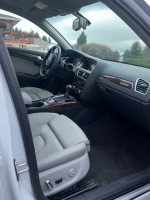 Interior view of a 2013 Audi A4 2.0T Premium with leather seats, navigation, and premium features.