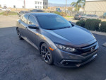 2019 Honda Civic Sport in grey, 4-door, parked with features like air conditioning and Bluetooth connectivity