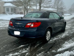 2008 Chrysler Sebring Convertible LX parked in the snow, showcasing excellent condition and stylish design.