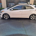 2013 Hyundai Elantra GT in excellent condition, white exterior with custom rims, for sale with 126,000 miles.