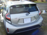 2019 Toyota Prius C hybrid parked, showcasing excellent condition and distinctive rear design.