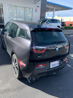 Black 2014 BMW i3 with Terra package parked, showcasing sleek design and modern features