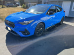 2024 Subaru Impreza RS in oasis blue, featuring AWD, automatic transmission, and sunroof.