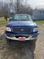 1998 Ford F150 XLT extended cab 4X4 in blue with 79,412 miles, well-maintained and garage kept.