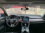 Interior view of a well-maintained 2016 Honda Civic EX with modern dashboard and infotainment system.