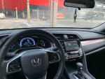 Interior view of a well-maintained 2016 Honda Civic EX, highlighting dashboard and infotainment system.